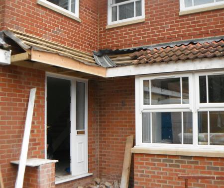 Repositioning of the front entrance to create a larger bay window in the lounge with L shape canopy over entrance and bay