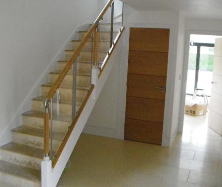 Re-positioned staircase with oak and glass ballustrade