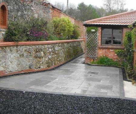 Extensive renovation of lime mortar wall and hardlandscaping