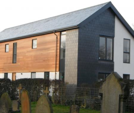 Finished property showing slate cladding to side & rear elevation