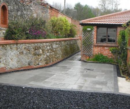 original lime mortar wall rebuilt and restored to its former glory